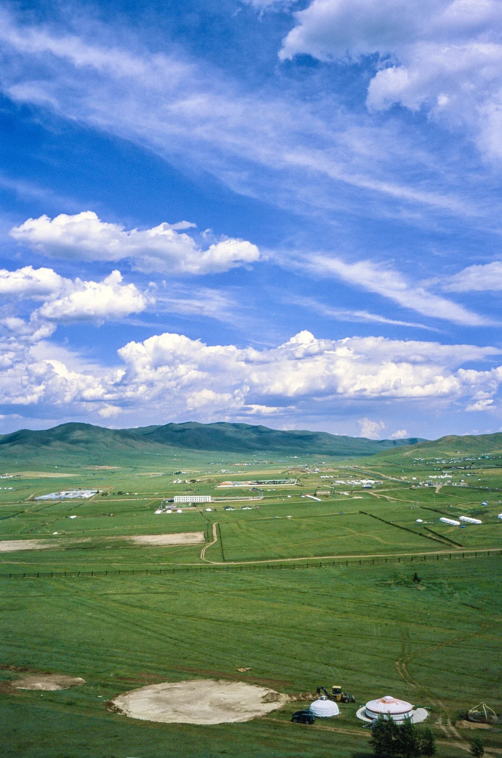 Clouds over open grassland